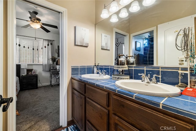 11576 Meridian Rd, Chico, CA 95973 - full bath with double vanity, a ceiling fan, and baseboards