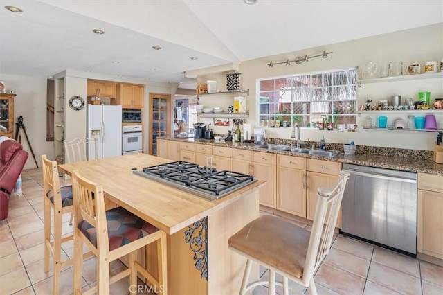 28532 Forest Meadow Pl, Castaic, CA 91384 - kitchen with stainless steel appliances, light tile patterned floors, open shelves, a sink, and lofted ceiling