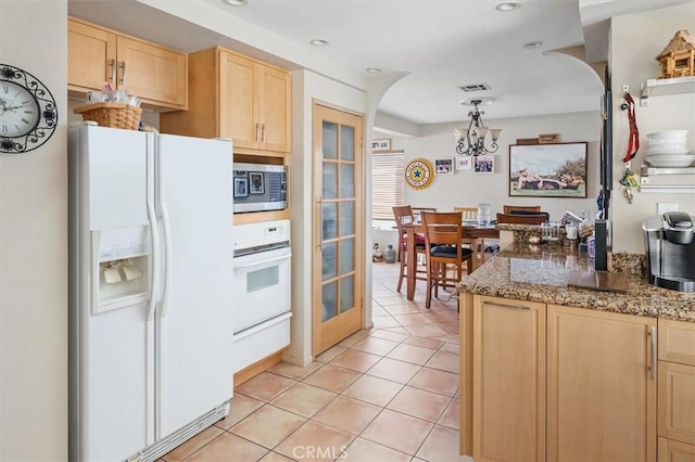 28532 Forest Meadow Pl, Castaic, CA 91384 - kitchen featuring white appliances, light brown cabinets, a chandelier, light tile patterned floors, and stone counters