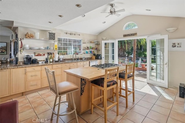 28532 Forest Meadow Pl, Castaic, CA 91384 - kitchen with open shelves, a sink, light brown cabinetry, vaulted ceiling, and light tile patterned floors