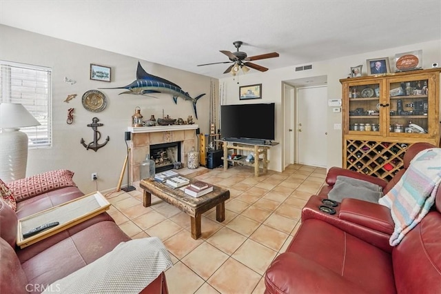 28532 Forest Meadow Pl, Castaic, CA 91384 - living room featuring light tile patterned flooring, ceiling fan, and a tile fireplace