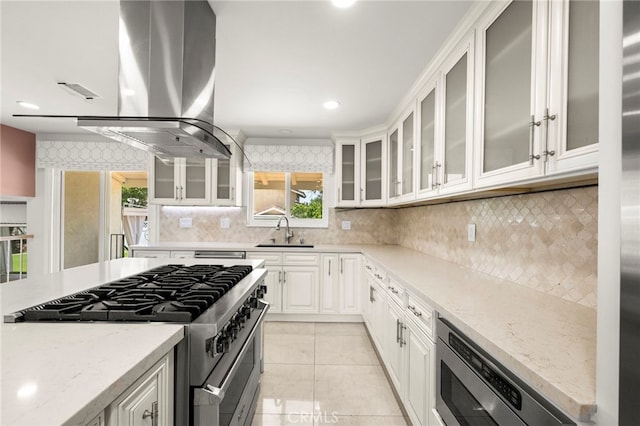 241 S Solomon Dr, Anaheim, CA 92807 - kitchen featuring stainless steel appliances, a sink, light stone counters, tasteful backsplash, and recessed lighting