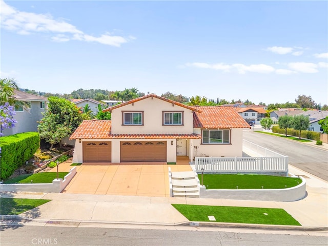 241 S Solomon Dr, Anaheim, CA 92807 - mediterranean / spanish-style house with a tiled roof, stucco siding, driveway, and a residential view