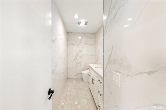 241 S Solomon Dr, Anaheim, CA 92807 - bathroom with vanity, toilet, tile walls, a marble finish shower, and recessed lighting
