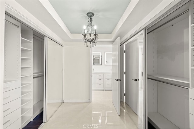 241 S Solomon Dr, Anaheim, CA 92807 - spacious closet featuring a chandelier, light tile patterned floors, and a tray ceiling