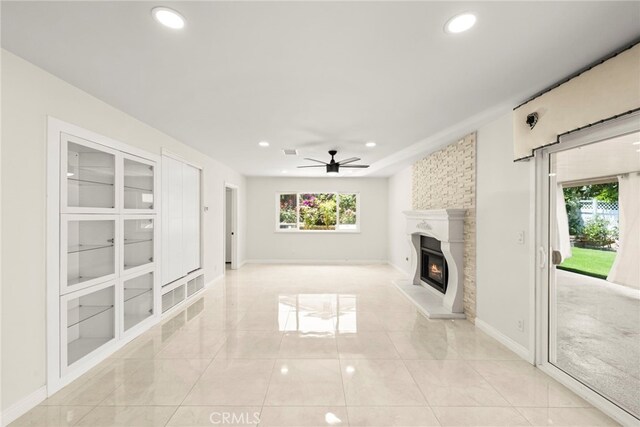 241 S Solomon Dr, Anaheim, CA 92807 - unfurnished living room with a ceiling fan, recessed lighting, a glass covered fireplace, and baseboards