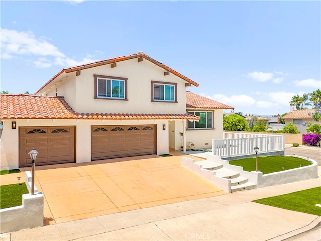 241 S Solomon Dr, Anaheim, CA 92807 - mediterranean / spanish-style home featuring driveway, stucco siding, a tiled roof, and a front lawn