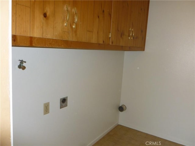 26276 Foxgrove Rd, Menifee, CA 92586 - laundry room featuring hookup for an electric dryer, cabinet space, and baseboards