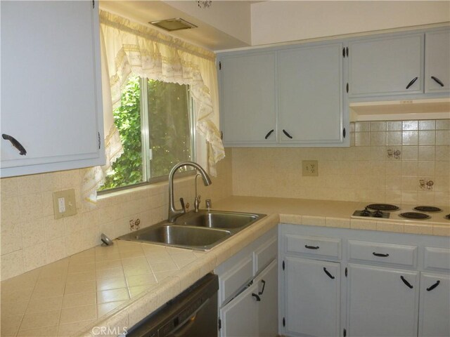 26276 Foxgrove Rd, Menifee, CA 92586 - kitchen with a sink, under cabinet range hood, dishwasher, white electric cooktop, and backsplash