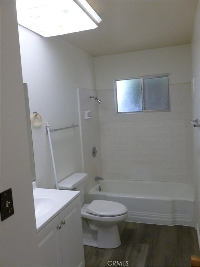 26276 Foxgrove Rd, Menifee, CA 92586 - bathroom with toilet, wood finished floors, vanity, and tub / shower combination