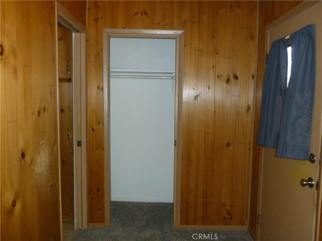26276 Foxgrove Rd, Menifee, CA 92586 - hallway with wood walls and carpet floors