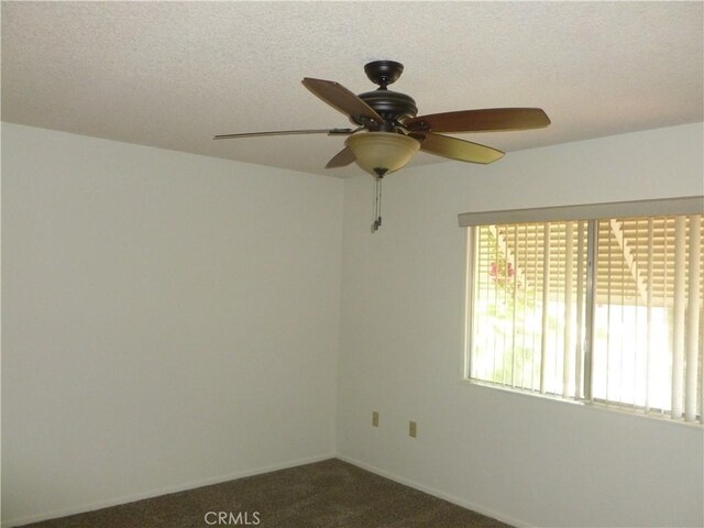 26276 Foxgrove Rd, Menifee, CA 92586 - spare room featuring a ceiling fan, dark colored carpet, baseboards, and a textured ceiling
