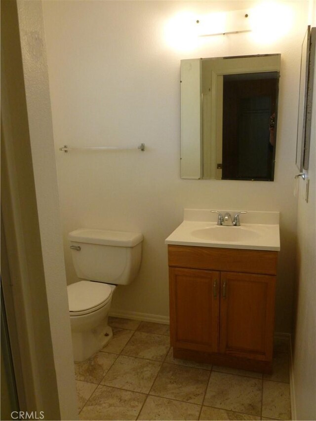 26276 Foxgrove Rd, Menifee, CA 92586 - half bathroom with vanity, toilet, tile patterned flooring, and baseboards