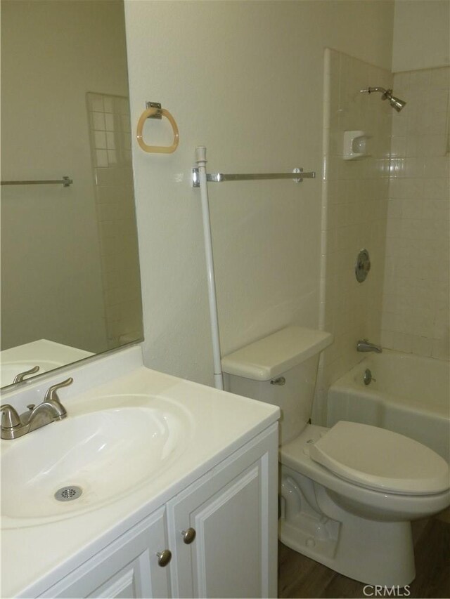 26276 Foxgrove Rd, Menifee, CA 92586 - bathroom featuring toilet, vanity, and tub / shower combination