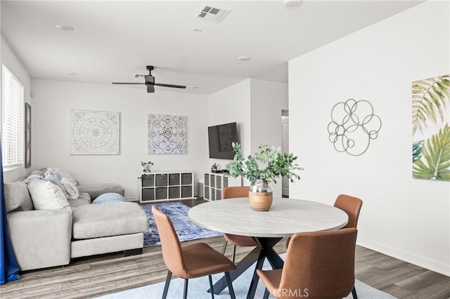 1924 N Floret Dr, Los Angeles, CA 90222 - dining space with wood finished floors, a ceiling fan, and baseboards