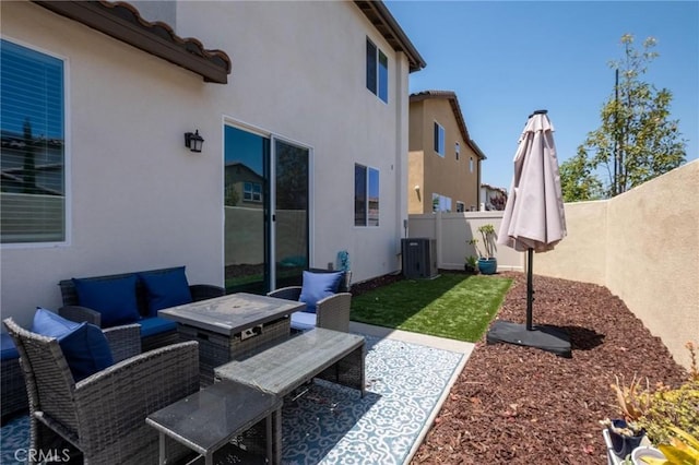 1924 N Floret Dr, Los Angeles, CA 90222 - fenced backyard with an outdoor living space, a patio area, and central air condition unit