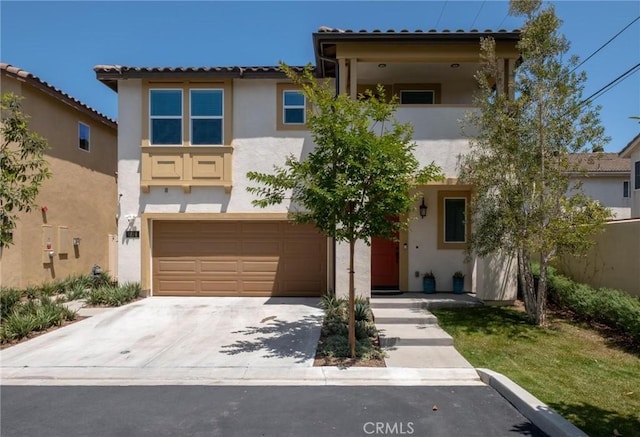 1924 N Floret Dr, Los Angeles, CA 90222 - view of front of home with stucco siding, a garage, and concrete driveway