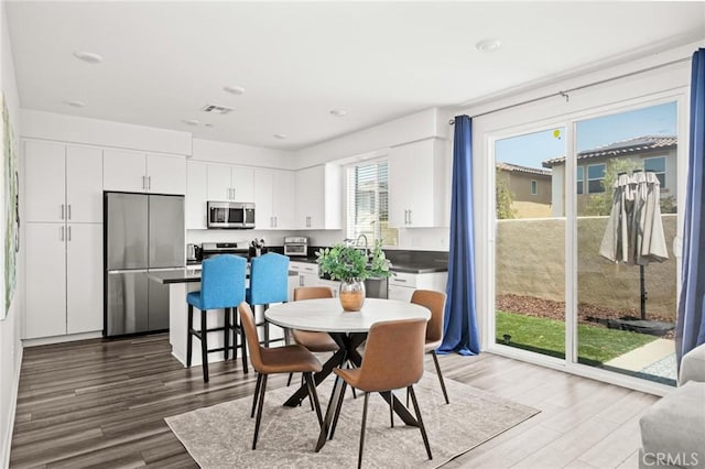 1924 N Floret Dr, Los Angeles, CA 90222 - dining area featuring wood finished floors and recessed lighting