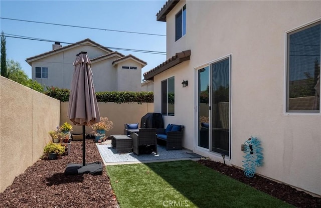 1924 N Floret Dr, Los Angeles, CA 90222 - fenced backyard featuring a patio area and outdoor lounge area
