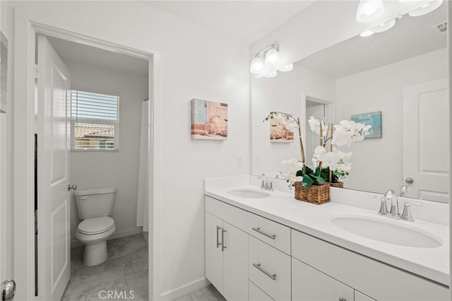 1924 N Floret Dr, Los Angeles, CA 90222 - full bath with double vanity, toilet, and baseboards