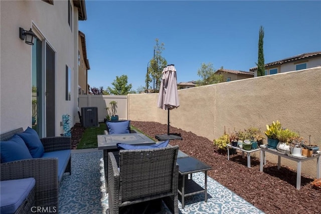 1924 N Floret Dr, Los Angeles, CA 90222 - fenced backyard featuring a patio, an outdoor hangout area, central AC unit, and outdoor dining space