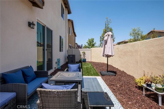 1924 N Floret Dr, Los Angeles, CA 90222 - fenced backyard with an outdoor living space, central AC, and a patio