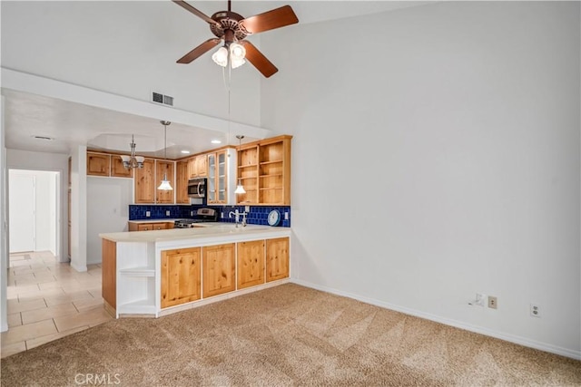44114 30th St W, Lancaster, CA 93536 - kitchen with appliances with stainless steel finishes, open shelves, a peninsula, light carpet, and ceiling fan