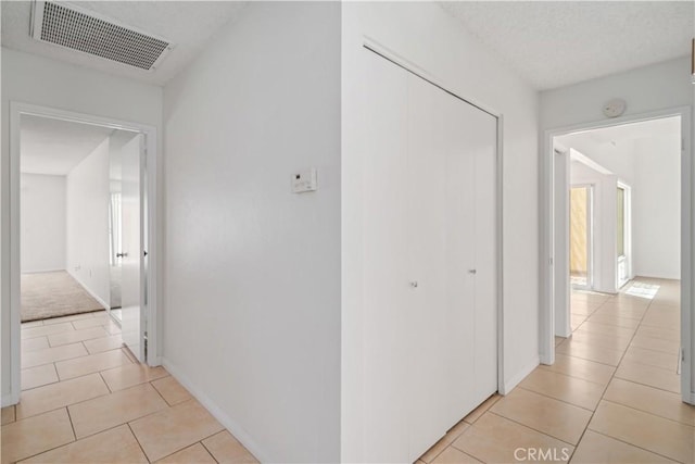 44114 30th St W, Lancaster, CA 93536 - hallway with light tile patterned flooring and baseboards