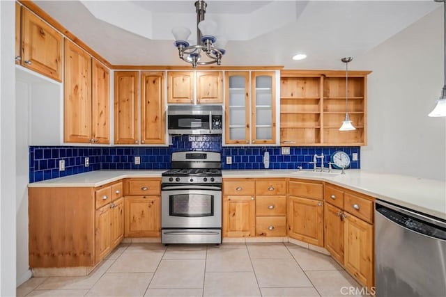 44114 30th St W, Lancaster, CA 93536 - kitchen featuring stainless steel appliances, a sink, light tile patterned flooring, and a chandelier