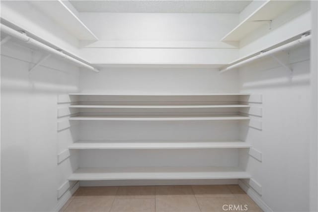44114 30th St W, Lancaster, CA 93536 - walk in closet with light tile patterned floors
