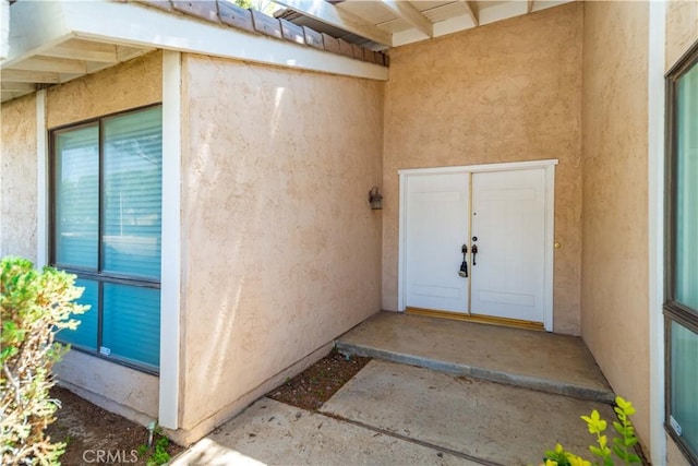 44114 30th St W, Lancaster, CA 93536 - doorway to property with stucco siding