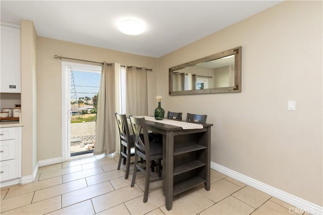 901 S Clymar Ave, Compton, CA 90220 - dining room featuring baseboards and light tile patterned floors