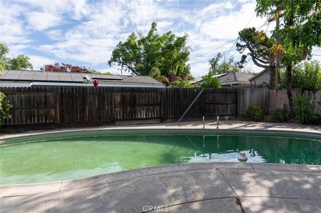 635 Brookdale Dr, Merced, CA 95340 - view of swimming pool featuring a fenced backyard