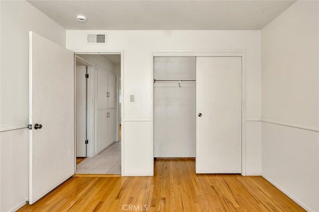 635 Brookdale Dr, Merced, CA 95340 - unfurnished bedroom featuring a closet, light wood-style floors, and baseboards