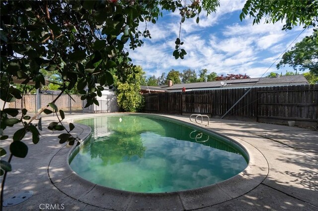635 Brookdale Dr, Merced, CA 95340 - view of pool with a fenced backyard and a patio area