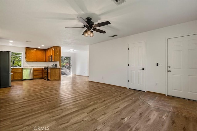 50 Walter Blume Ln, Oroville, CA 95966 - unfurnished living room with wood finished floors, a ceiling fan, and recessed lighting