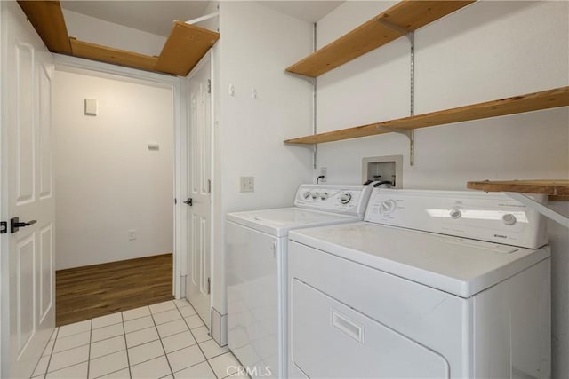 50 Walter Blume Ln, Oroville, CA 95966 - laundry room with washer and clothes dryer and light tile patterned floors