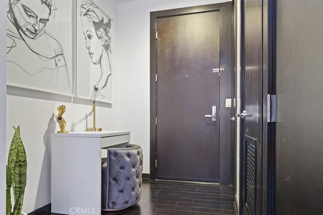 655 S Hope St Unit 903, Los Angeles, CA 90017 - laundry area with wood finish floors and baseboards