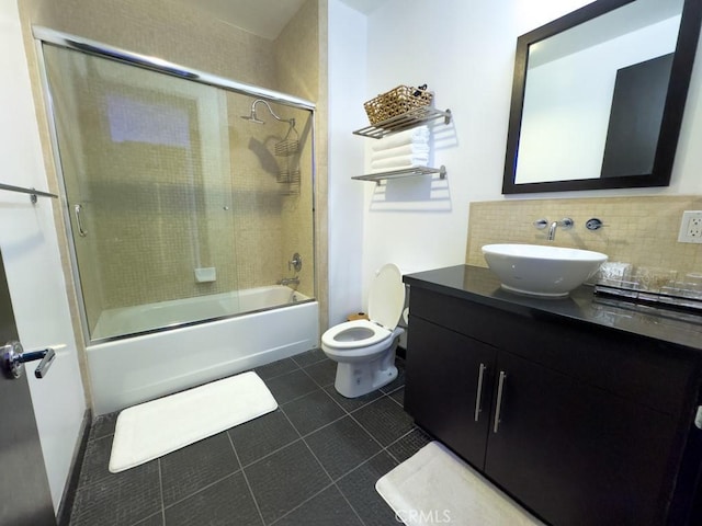 655 S Hope St Unit 903, Los Angeles, CA 90017 - full bathroom with toilet, vanity, enclosed tub / shower combo, decorative backsplash, and tile patterned flooring