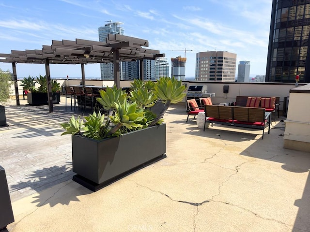 655 S Hope St Unit 903, Los Angeles, CA 90017 - view of patio with an outdoor hangout area, a pergola, and a city view