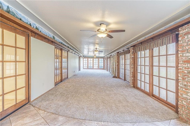 40052 18th St W, Palmdale, CA 93551 - empty room with carpet flooring, a ceiling fan, and tile patterned flooring
