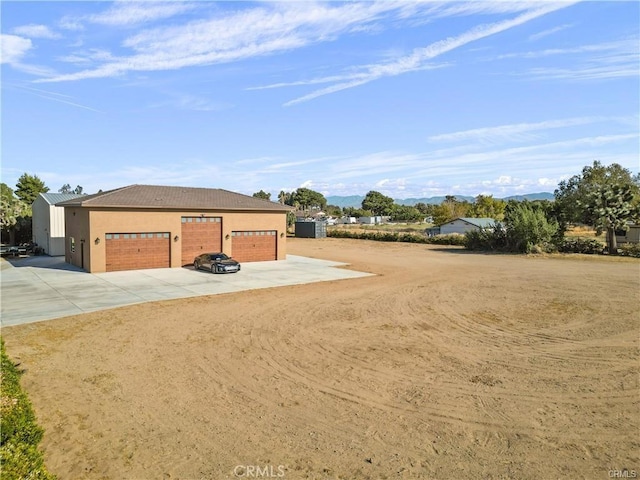 40052 18th St W, Palmdale, CA 93551 - detached garage featuring driveway