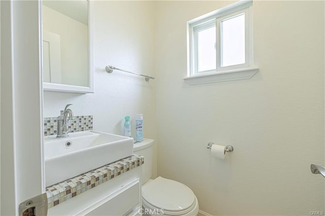 40052 18th St W, Palmdale, CA 93551 - bathroom with toilet, vanity, and backsplash