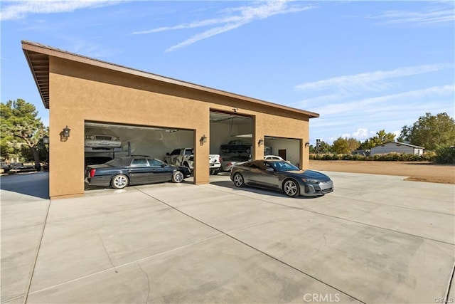 40052 18th St W, Palmdale, CA 93551 - view of home's exterior with stucco siding and a detached garage