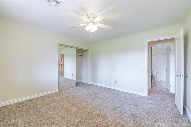 40052 18th St W, Palmdale, CA 93551 - unfurnished bedroom featuring carpet flooring, a closet, baseboards, and a ceiling fan