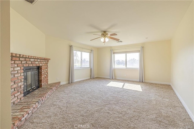 40052 18th St W, Palmdale, CA 93551 - unfurnished living room with a ceiling fan, carpet floors, a brick fireplace, and baseboards