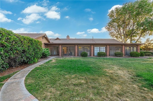 40052 18th St W, Palmdale, CA 93551 - back of property with a lawn and a chimney