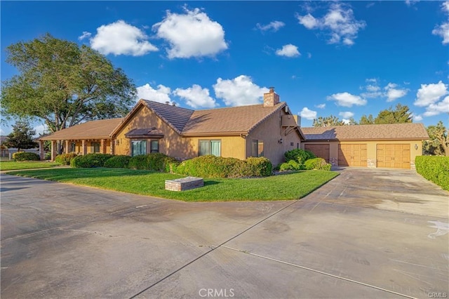 40052 18th St W, Palmdale, CA 93551 - ranch-style home featuring concrete driveway, a chimney, a garage, stucco siding, and a front yard