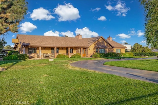 40052 18th St W, Palmdale, CA 93551 - ranch-style home with a front lawn and a chimney