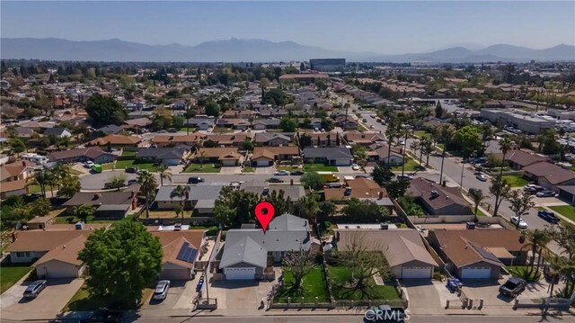 9945 Date St, Fontana, CA 92335 - aerial view of property and surrounding area with mountains and nearby suburban area